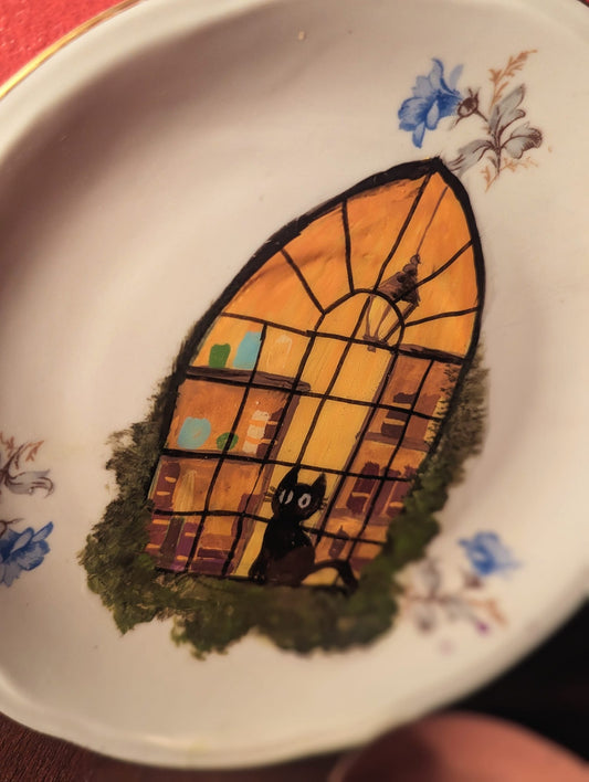 Cat in the shop window plate