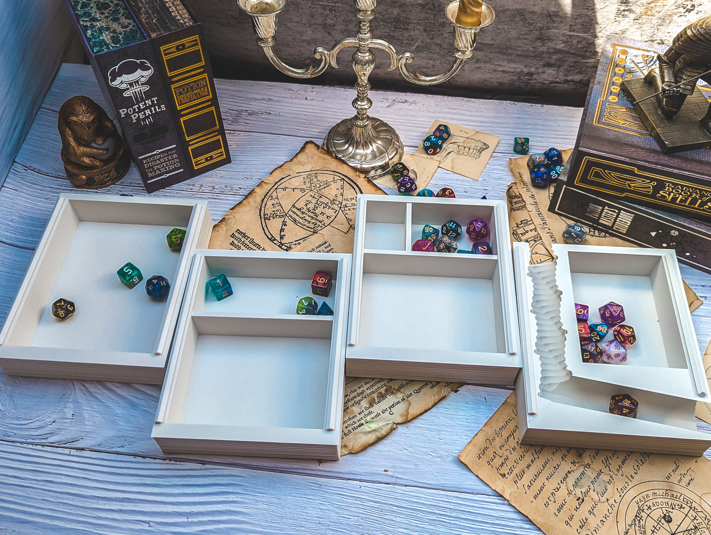 a table topped with lots of boxes filled with dice