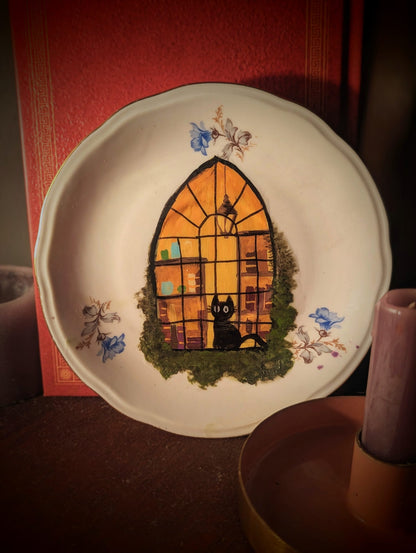 Cat in the shop window plate